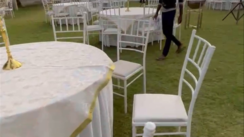 Round table seating with white chiavari chair