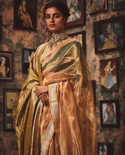 Gold tissue saree looks highly regal and good on brides for a royal wedding function. - 1