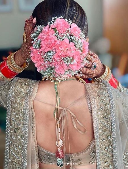 Look at these White vine kinda thing that's adding beauty to these floral buns - 2