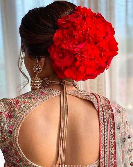 Backless blouse and big flower buns has a separate divinity about them! - 2
