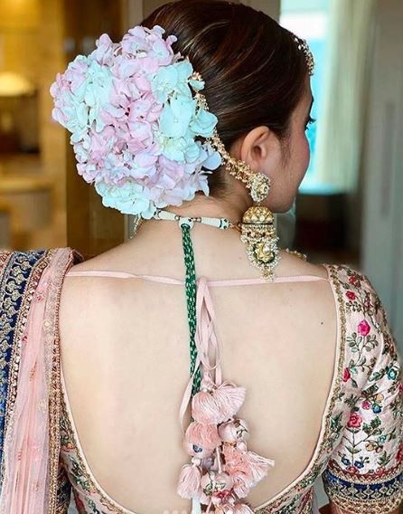 Backless blouse and big flower buns has a separate divinity about them! 1