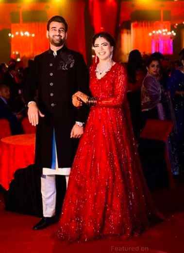 Red and black colour combination outfit for Bride and groom - 1