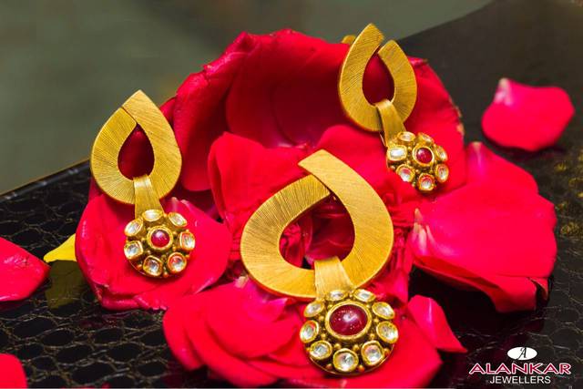 Alankar Jewellers, Jabalpur - Enhance your appearance with our captivating  set, adorned with precious stones, to exude a charming and enchanting aura.  Visit our store to explore the collection. Contact us at +