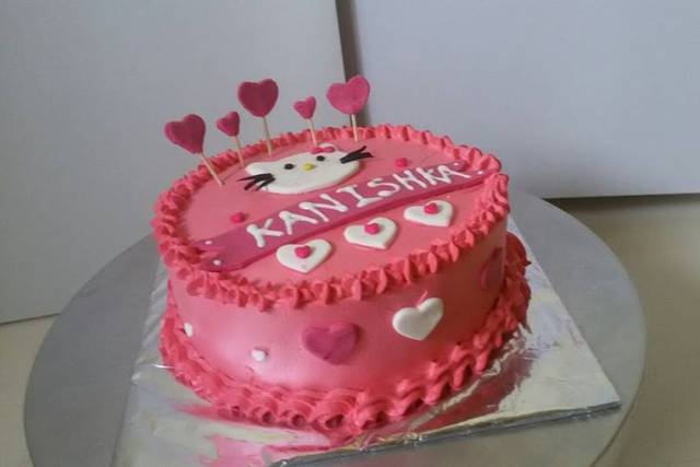 Sugar dough birthday cake. Cook, Red dress women, kitchen utensils.  Successful :)