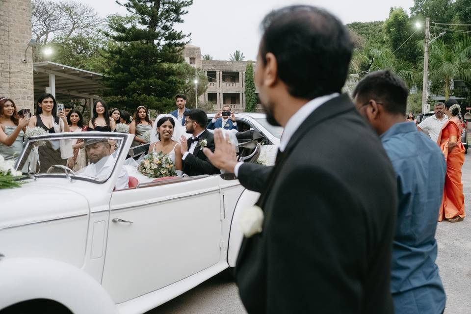 Dad waving bye to bride