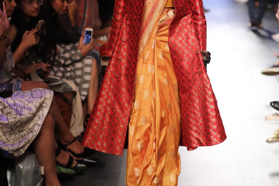 Banarasi sari & red trenchcoat