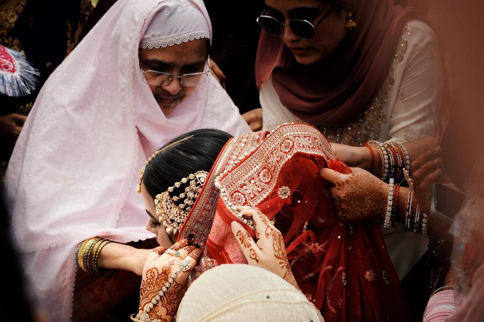 Family lifts the bridal veil