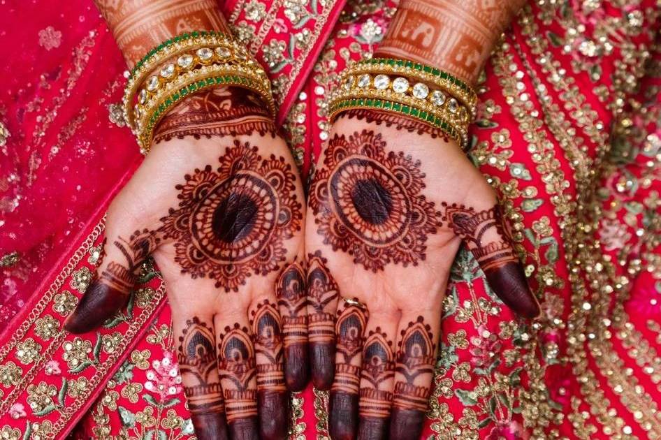 Photo of Stunning bridal mehendi with lotus motif designs