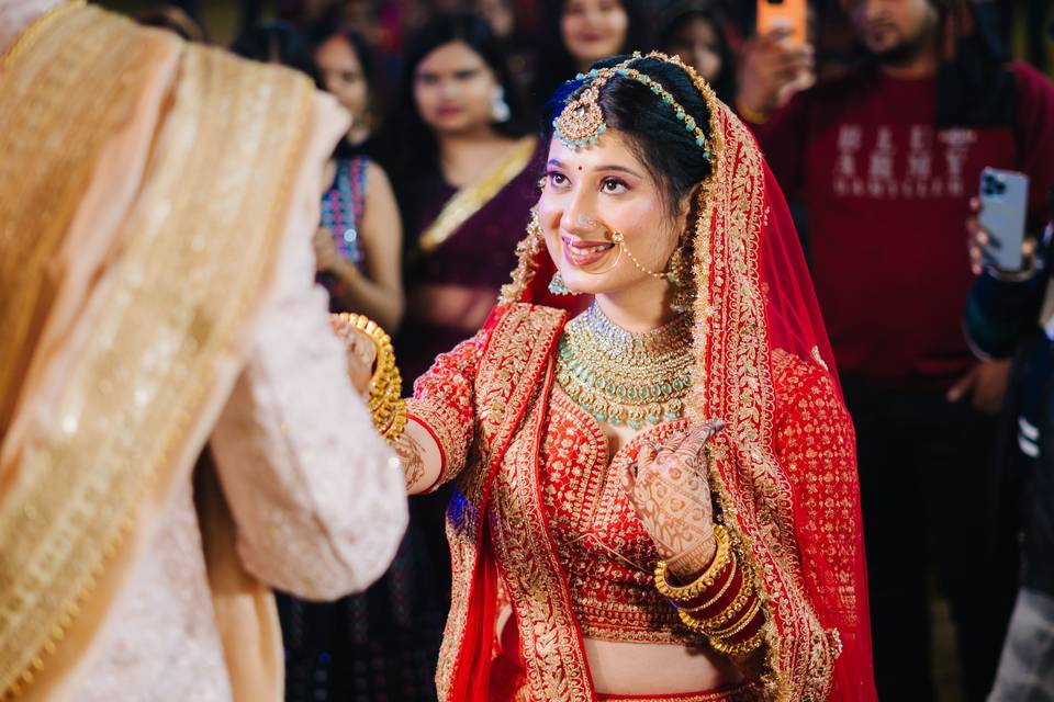 Groom holding his bride's hand