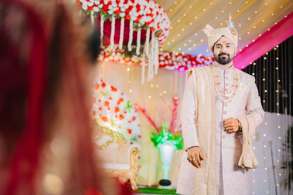 Groom looking at her bride