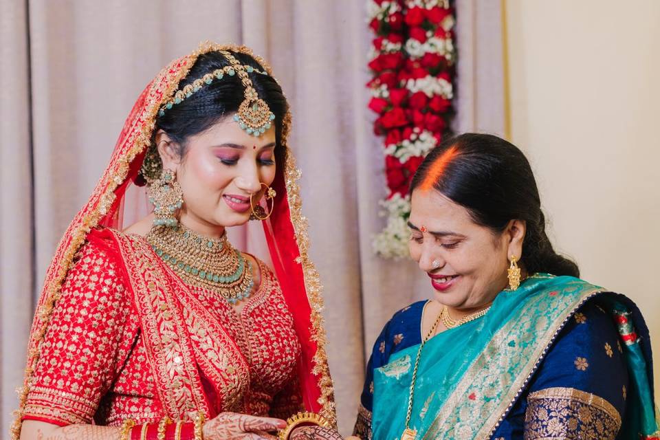 Mother looking Bride's mehandi