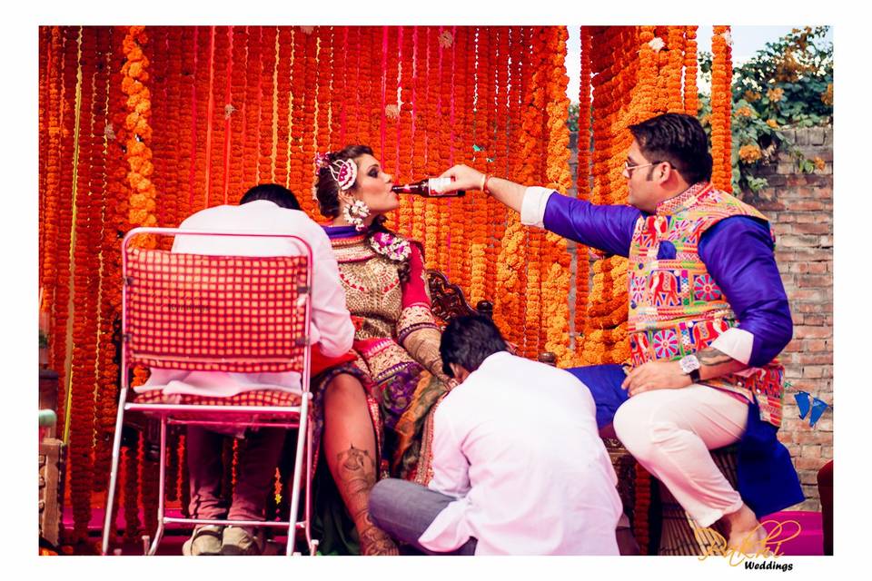 Couple having fun at Mehendi