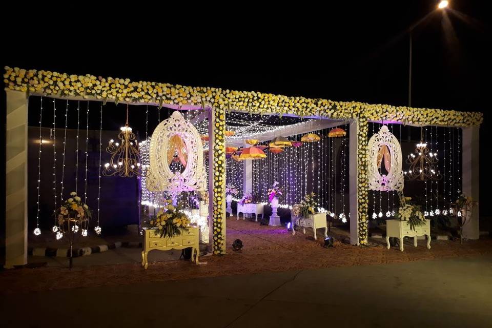 Gate to mandap with lighting