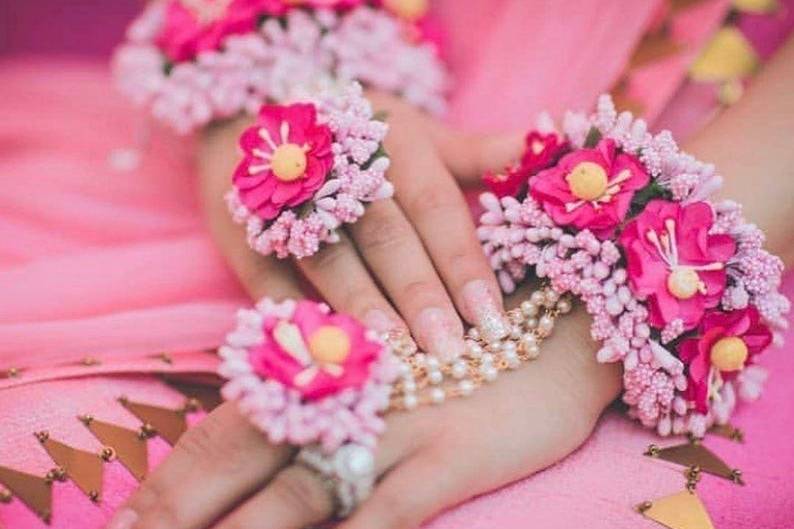 Yellow Pink and white floral jewellery  Hathphool bracelet for the bride   Mehendi and Wedding Accessories  Picture  Mahima Bhatia Photography   Curated by Witty Vows  Witty Vows