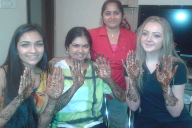 Happy clients showing their mehndi