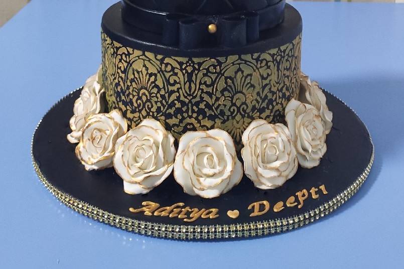 Black and gold engagement cake