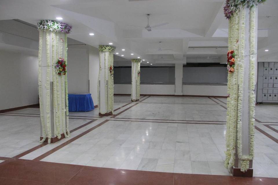 V One - White House Boutique Residences is a wedding venue located in Vadodara city. Plan your dream wedding at the dream destination. This wedding venue and its management staff will make it happen for you. From your wedding destination decor or marriage events, their hospitality staff will take the utmost care to make it memorable for you. This venue is located at a very accessible location. You and your guests can reach it via road. The event spaces provided here are suitable for all your special occasions. In totality, they offer a unique space for weddings and social events, large and small.  Facilities and Capacity  V One - White House Boutique Residences offers indoor and outdoor spaces to host your pre-wedding, wedding and post-wedding ceremonies. The whole property is well-built, with indoor and outdoor event spaces for different purposes. Plus, you will get all the fantastic and outstanding services. You can easily accommodate a guest list of 100 people at a time inside their banquet hall, which gives you enough space and options to host your wedding functions the way you like.  V One - White House Boutique Residences has a catering facility offering delicacies worth every penny. Only vegetarian food options are presented. The hotel provides many in-house facilities, making it a perfect choice for your special occasion. The kitchen also features a collection of mouth-watering cuisines with veg and non-veg options, which you can choose per your preferences and the price range. The list of the cuisines they provide is never-ending and will spoil you and your friends and family for choice. V One - White House Boutique Residences is the venue you need to book for your special day without thinking twice.  Services Offered  V One - White House Boutique Residences delivers what you demand. Their multi-cuisine menu has a wide range of delicious dishes that will act as the highlight of your wedding celebrations. The quality and quantity of the food will surely spoil you for choice. All the cuisines offered by their in-house chefs are.   North Indian/ Mughlai Italian/ European/ continental Chinese/ Thai/ Oriental South Indian Garlic Free/ Onion Free Live food counters Chaat & Indian street food Seafood Drinks (non-alcoholic)  