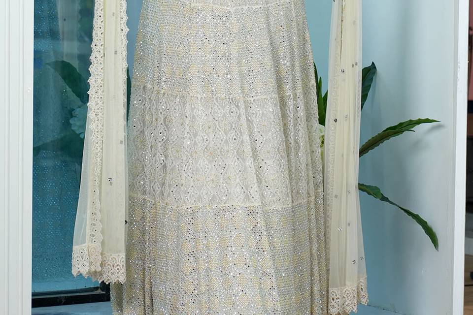 Ivory designer lehenga on rent