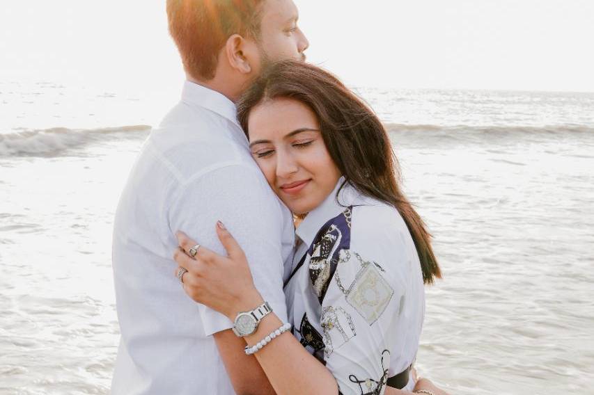 Beachside couple embrace - Inf