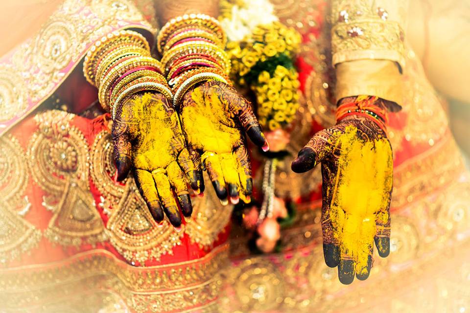 Haldi laden hands of the couple