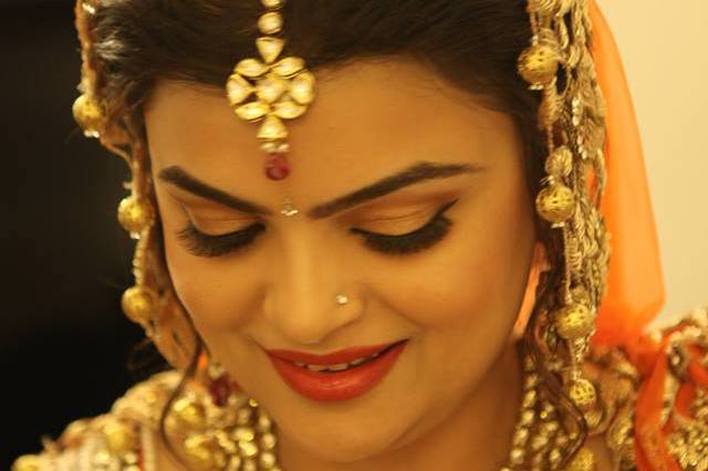 Bridal Makeup for Orange Lehenga