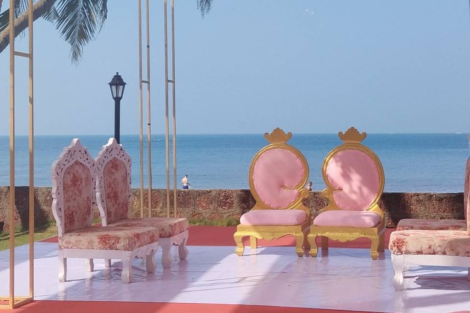 Bride and Groom sitting on man